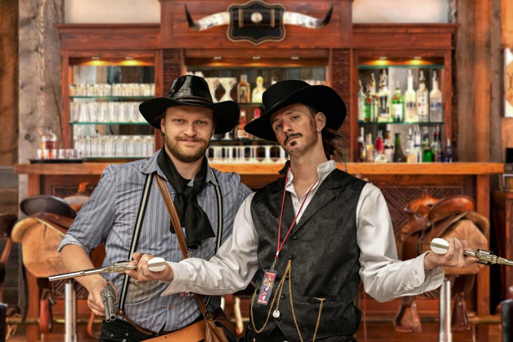 Two cowboys posing for a picture together in a bar.