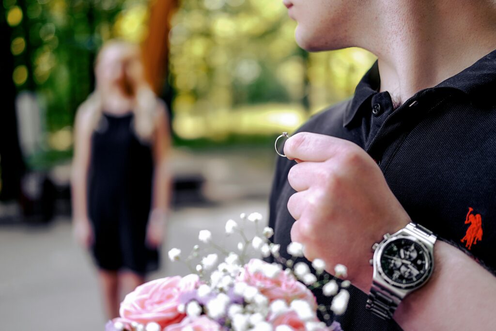 A boy anxiously holding a love ring, waiting for his girl.