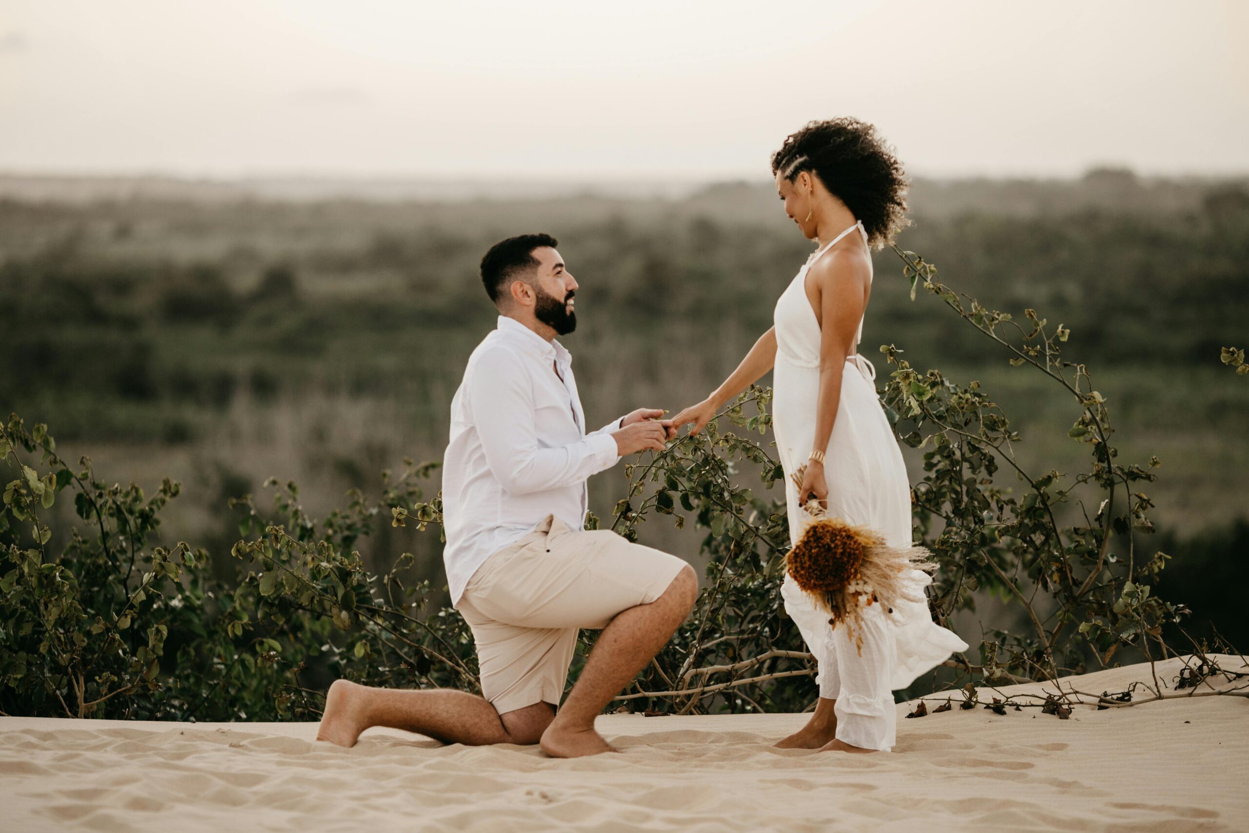 A man proposing to a woman in a desert-like setting, pondering what it means when a guy bumps into you on purpose.