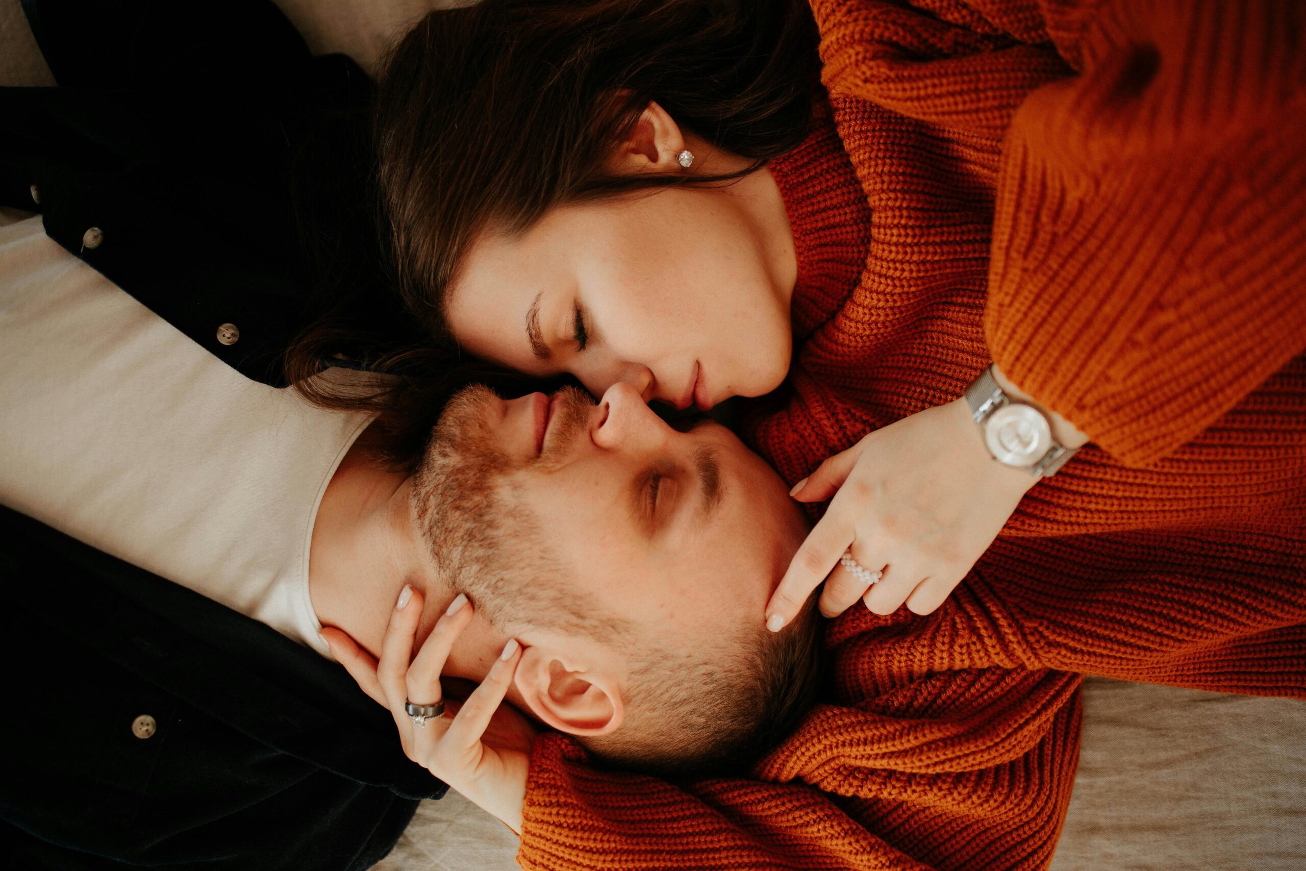 A couple lying on bed, talking and considering what it means when a guy nudges you with his elbow.